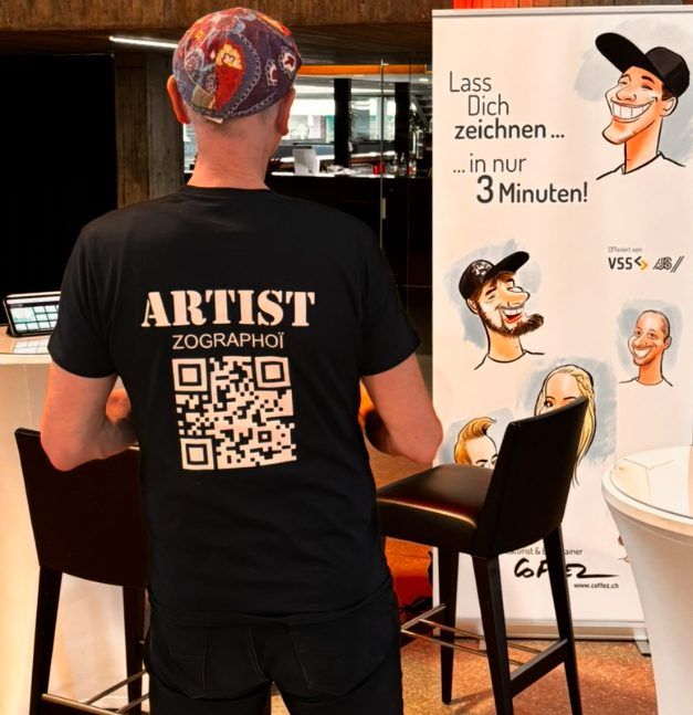 Pascal Coffez de dos, t-shirt Artist avec QR code, banderole « in nur 3 Minuten »